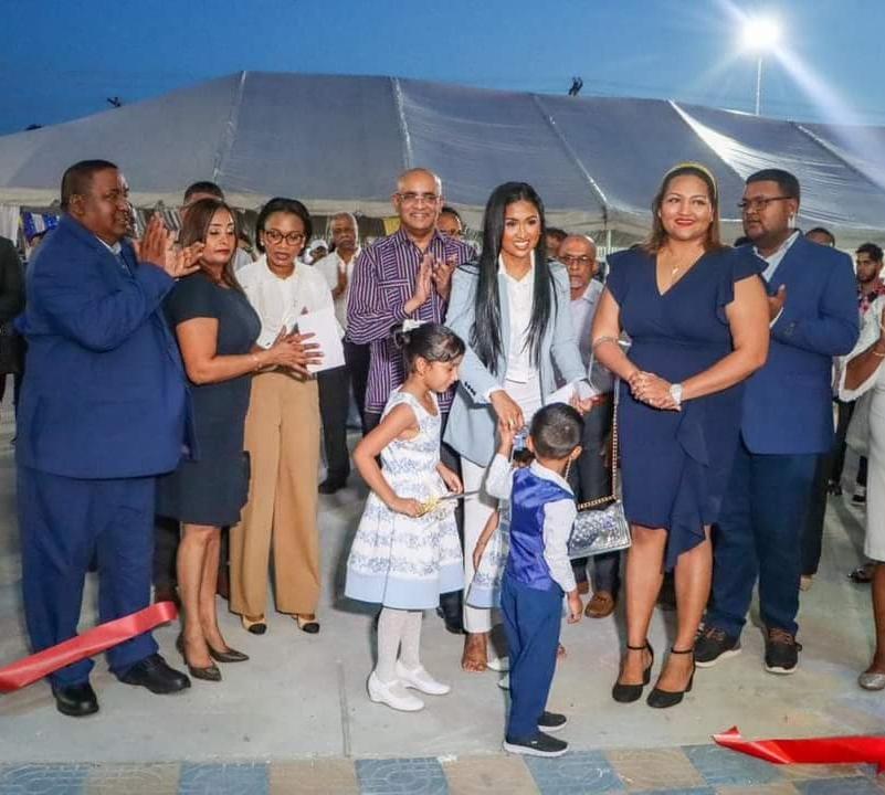 Developer of the West Central Mall, Hemraj Albert cut the ribbon on Friday with his family. Minister of Tourism, Industry and Commerce, Oneidge Walrond (third from left) and Vice President, Bharrat Jagdeo (fourth from left) offered well wishes to the family on their achievement.