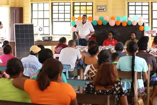 Minister of Housing and Water, Collin Croal addressing residents